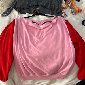 pink and red off the shoulder sweater